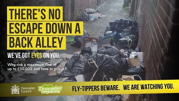 Fly-Tippers Beware Poster showing abandoned household waste in an alley